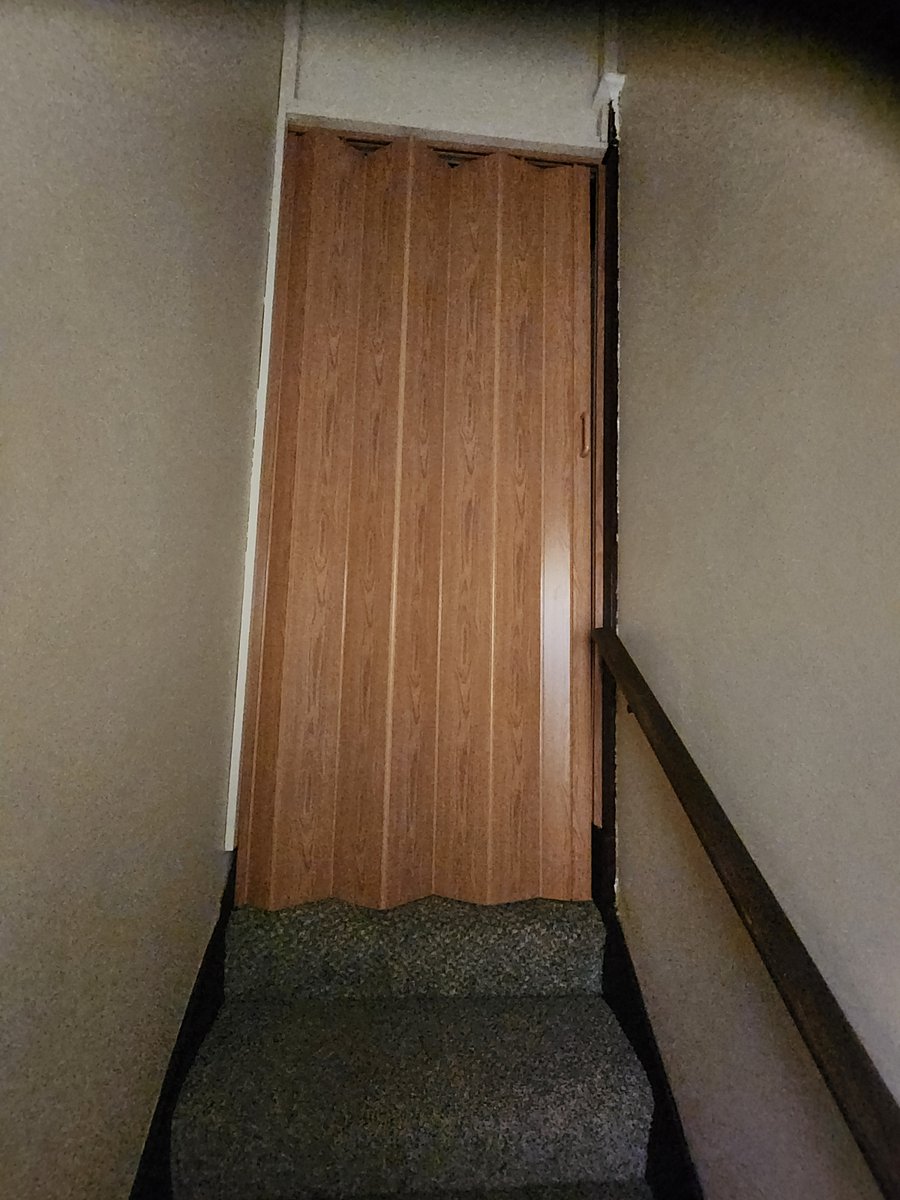 Door at top.of Stairway for apartment privacy.