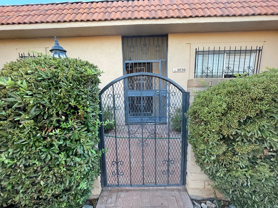 Welcome to your new home away from home!  View of front gate to courtyard and secure front entry.  