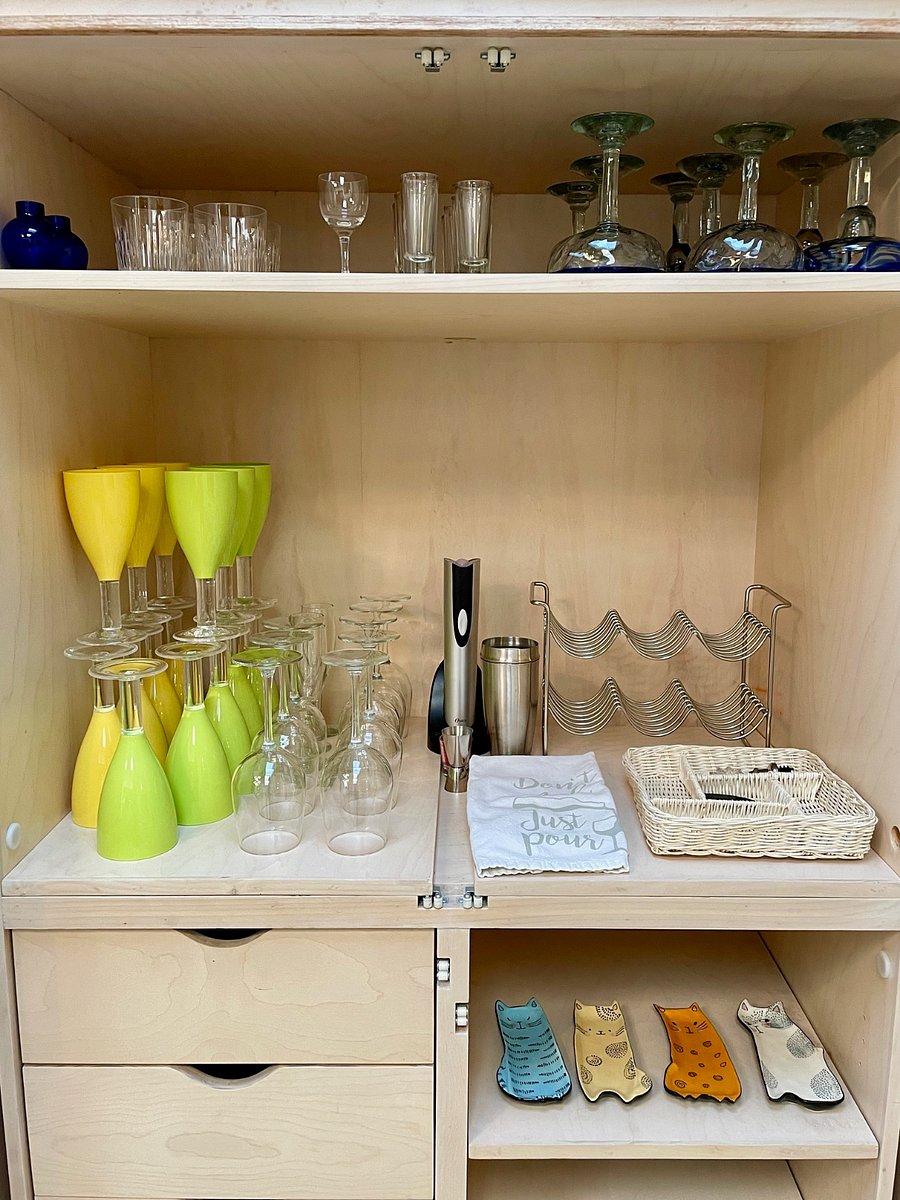 Entertainment cabinet in dining room, where you will find glassware, placemats, fabric napkins, electric wine opener, and more! 