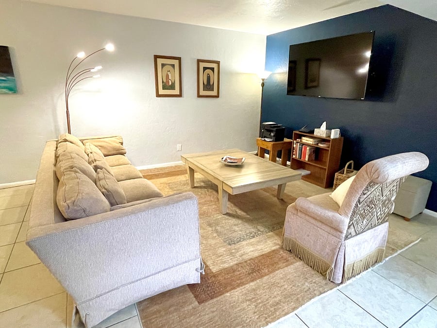 Living room with 65-inch Smart TV.   