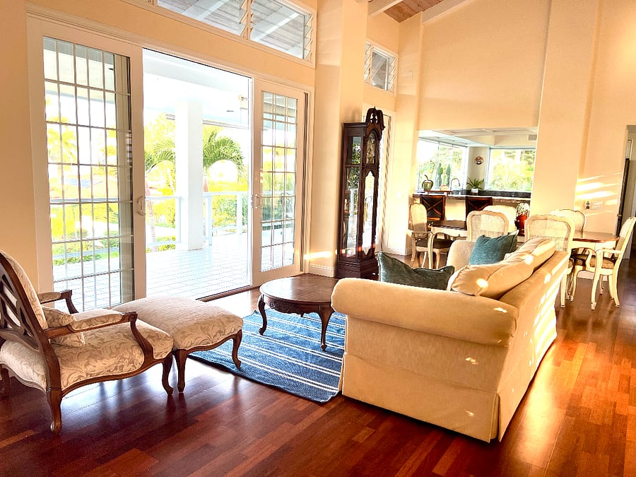 Great room on upper level with doors that open to the lanai