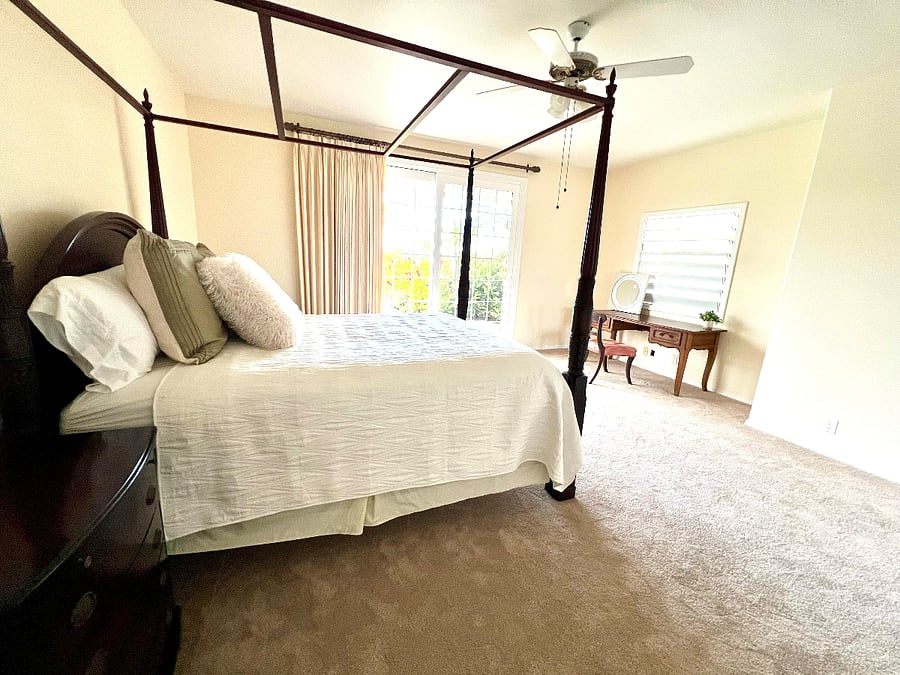 Bedroom #4 with door to pool and ensuite bathroom