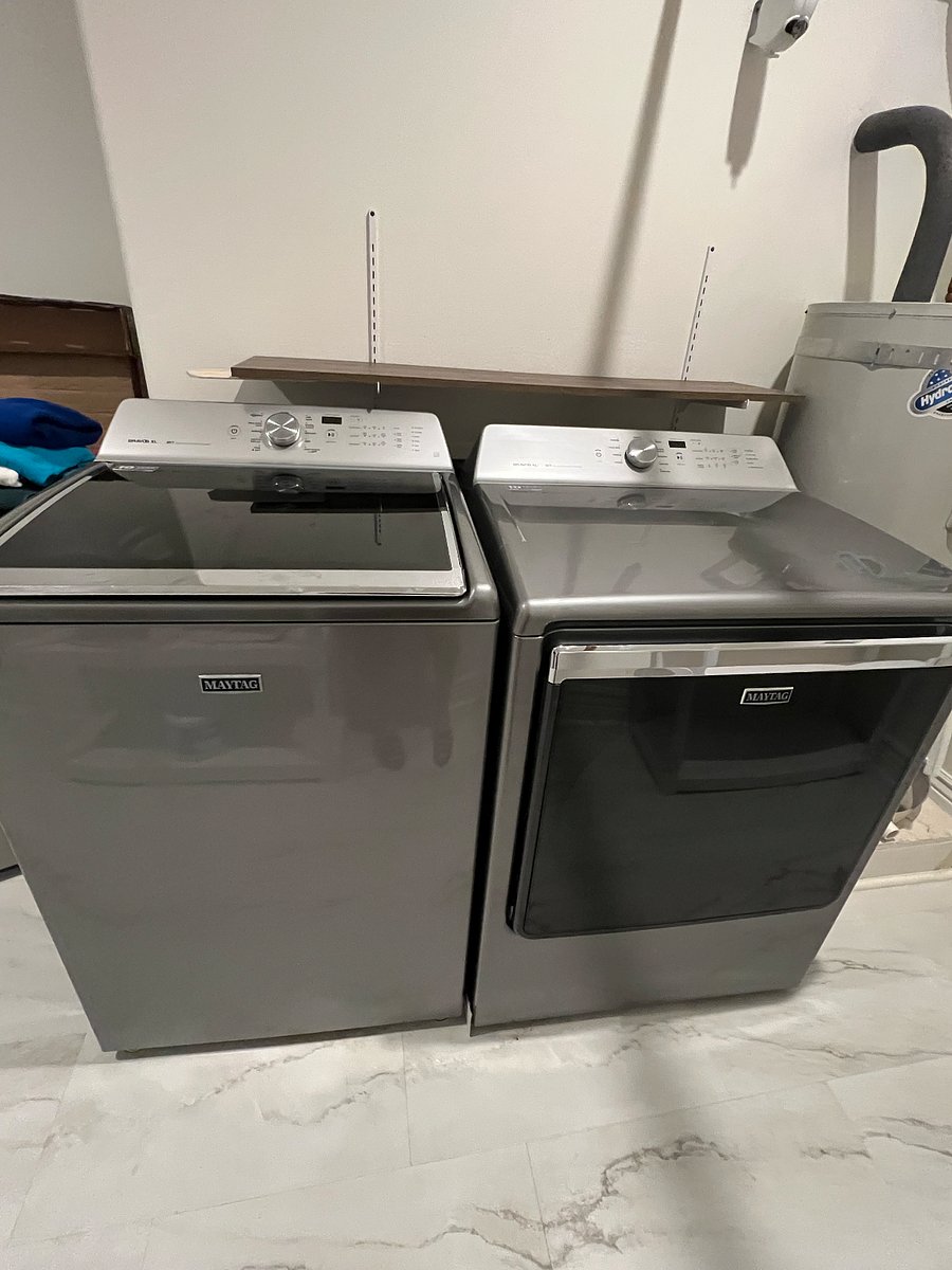 Laundry room with Maytag washer and dryer and plenty of shelving. Additional frig for Costco runs. Central vacuum.