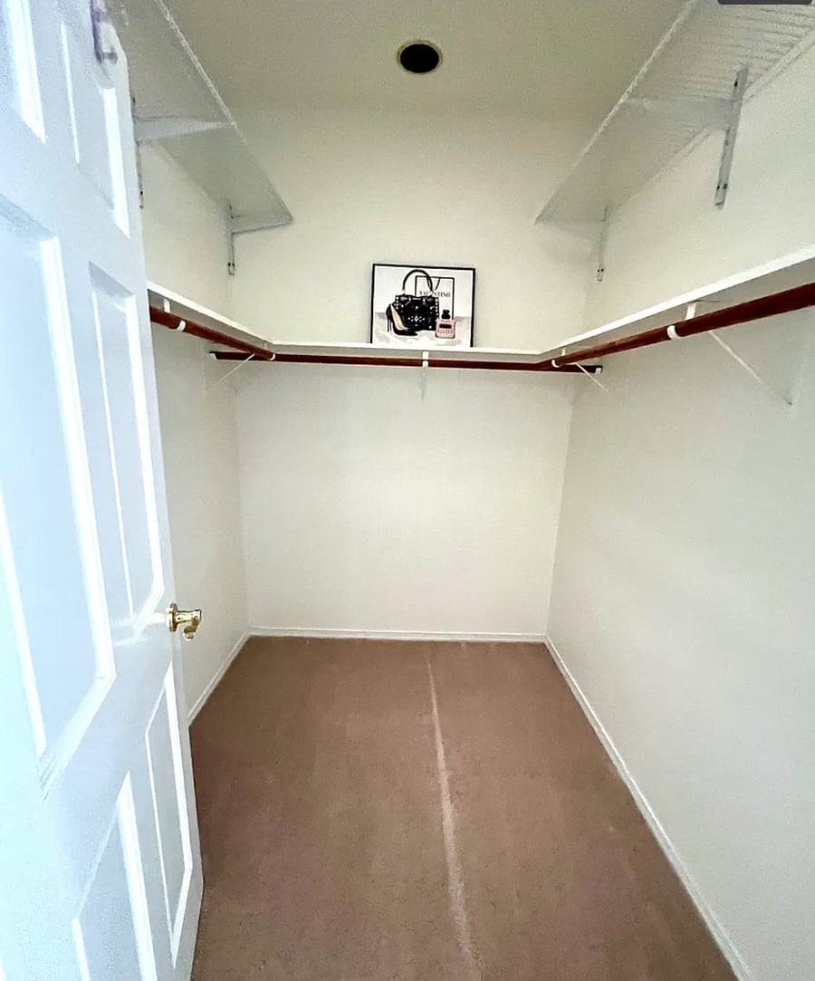 Walk-in closet #2 with skylight for Primary bedroom