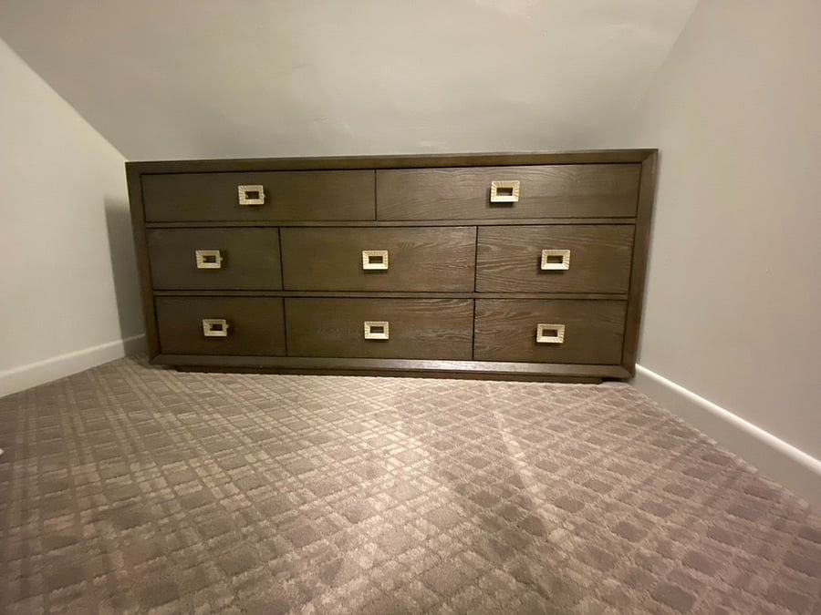 Large 60" long dresser inside the walk-in closet.