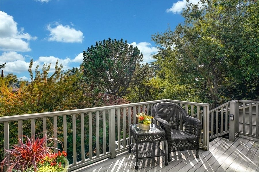 Private balcony overlooking scenic mountains and lush trees