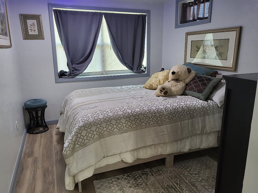 Queen pillow top bed, black out curtains.