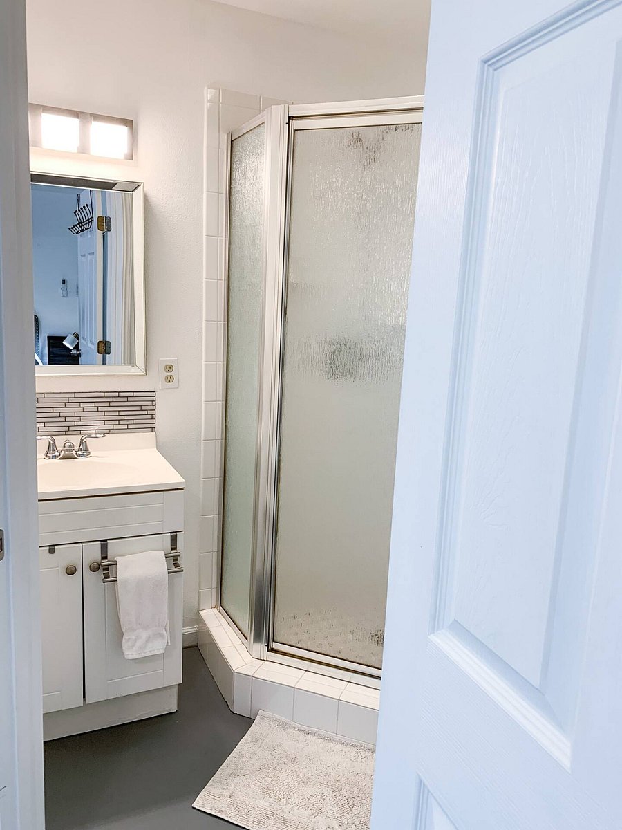 Bath vanity has under-sink storage space.
