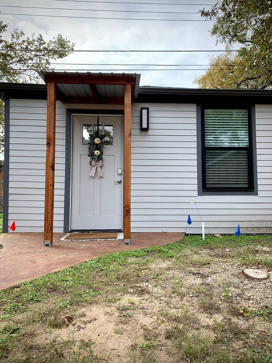 Small porch at front entrance. Guest house faces the backside of the main house. Door keypad for convenience.