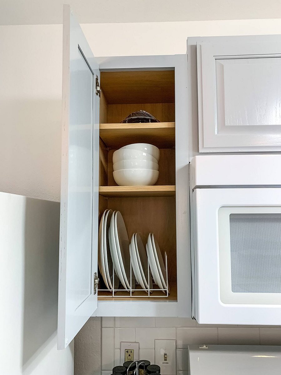 Cooking tools, pots/pans, utensils, baking pans, plateware, and silverware are provided.