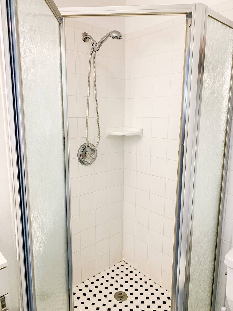 Convenient overhead shower can convert to a handheld shower wand.