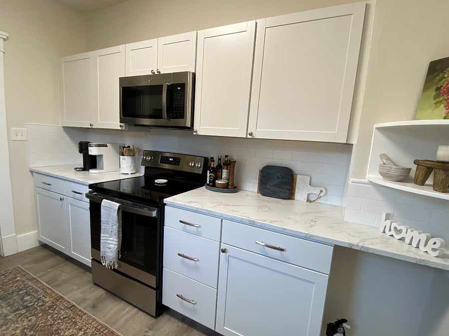 Full-sized kitchen includes Keurig and Nespresso machine. 