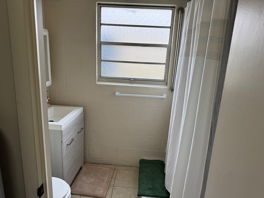 Private bathroom through laundry room 