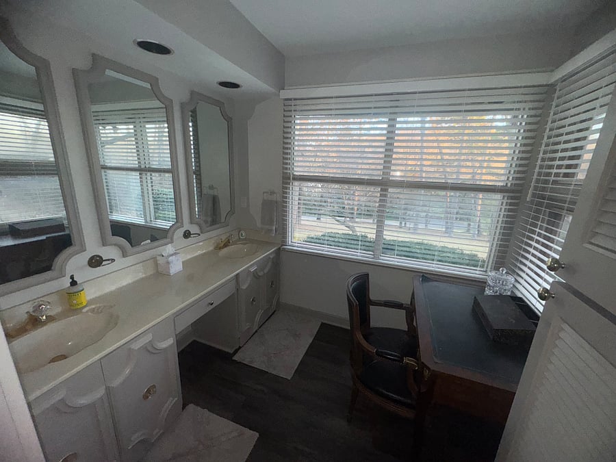 Master bath with double sinks and beautifully sunlit vanity area