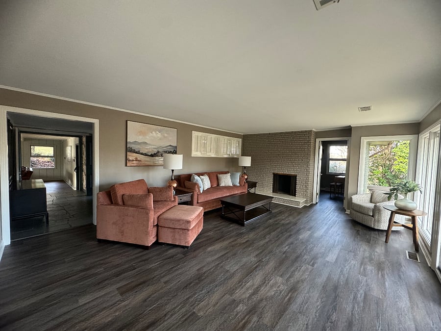Living room overlooking the lovely front deck and yard