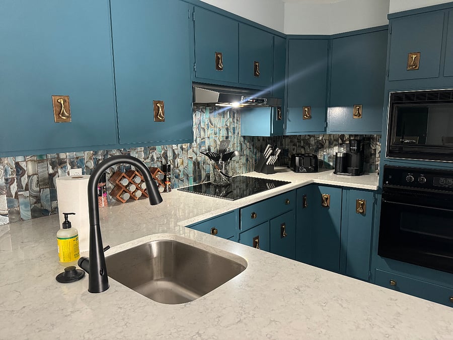 Updated kitchen with beautiful quartz countertops,stunning subway tile and new cooktop and dishwasher