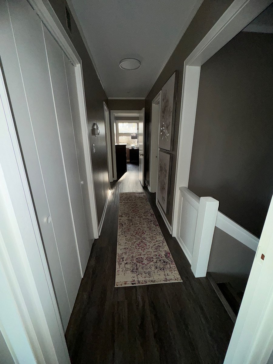 Hallway into bedrooms and bathrooms