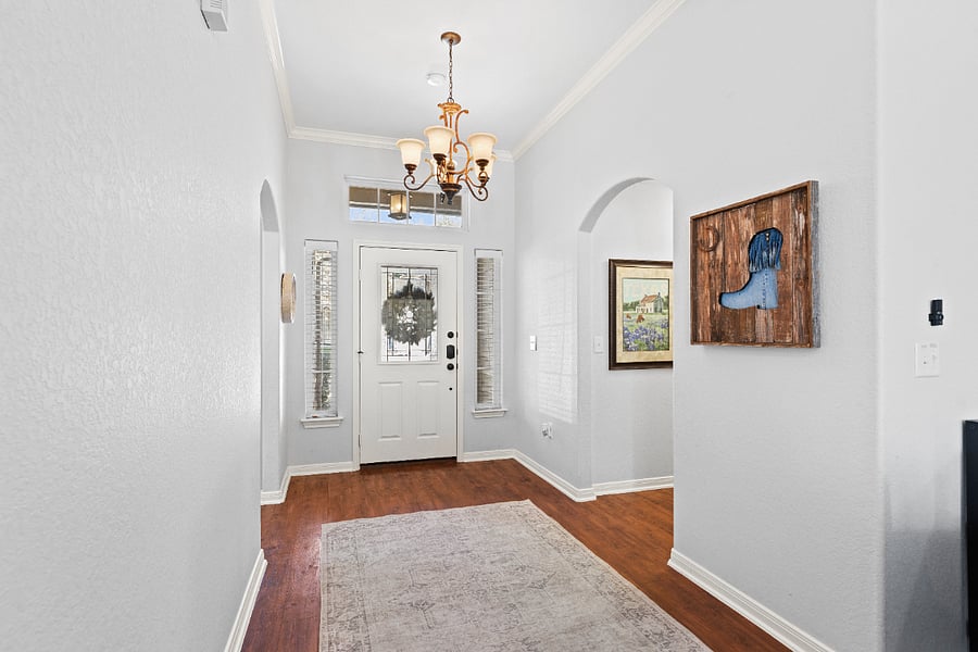 The foyer opens up into the family room. With high ceilings and a convenient layout, the house lives larger than its 1900 sq ft.