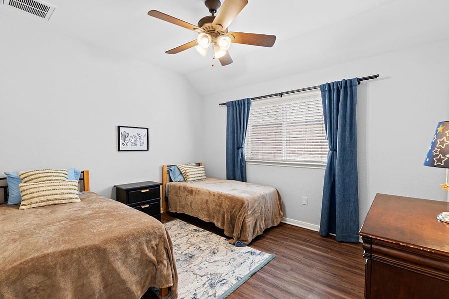 Bedroom with two twin beds and walk-in closet