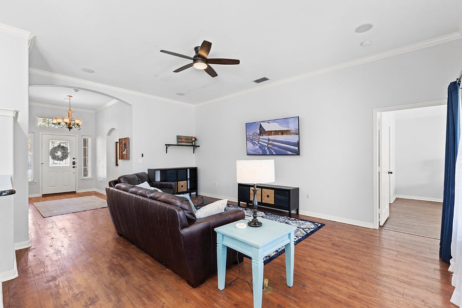 Family room with wall-mounted smart TV.