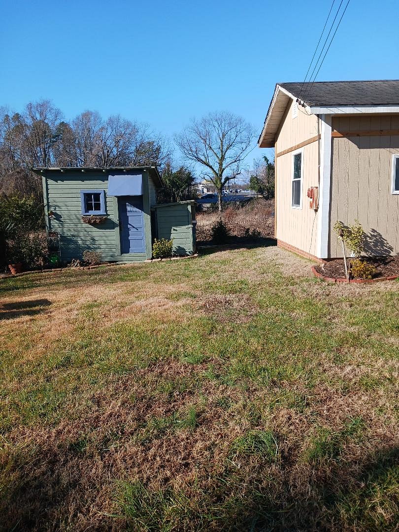 Cottage side view and garden shed