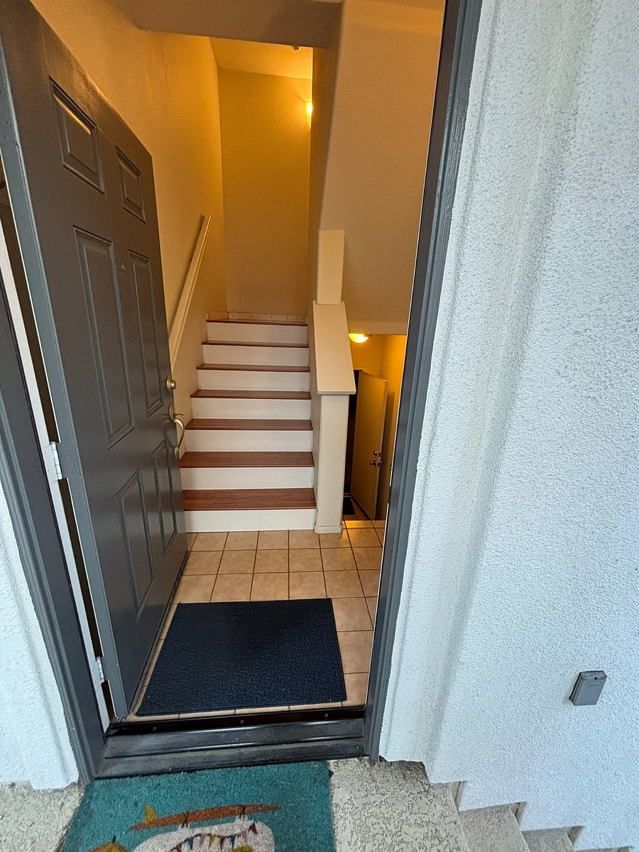 Front Door entrance, stairs up to condo, stairs down to garage