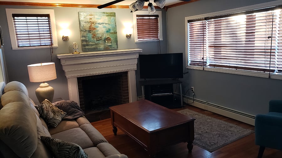 Living room with gas fireplace and smart tv