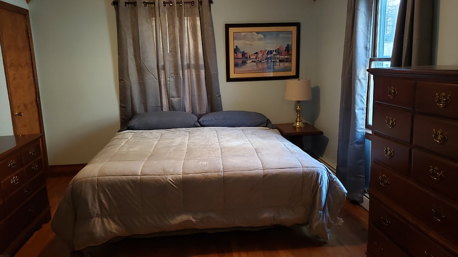 King size bed in downstairs bedroom