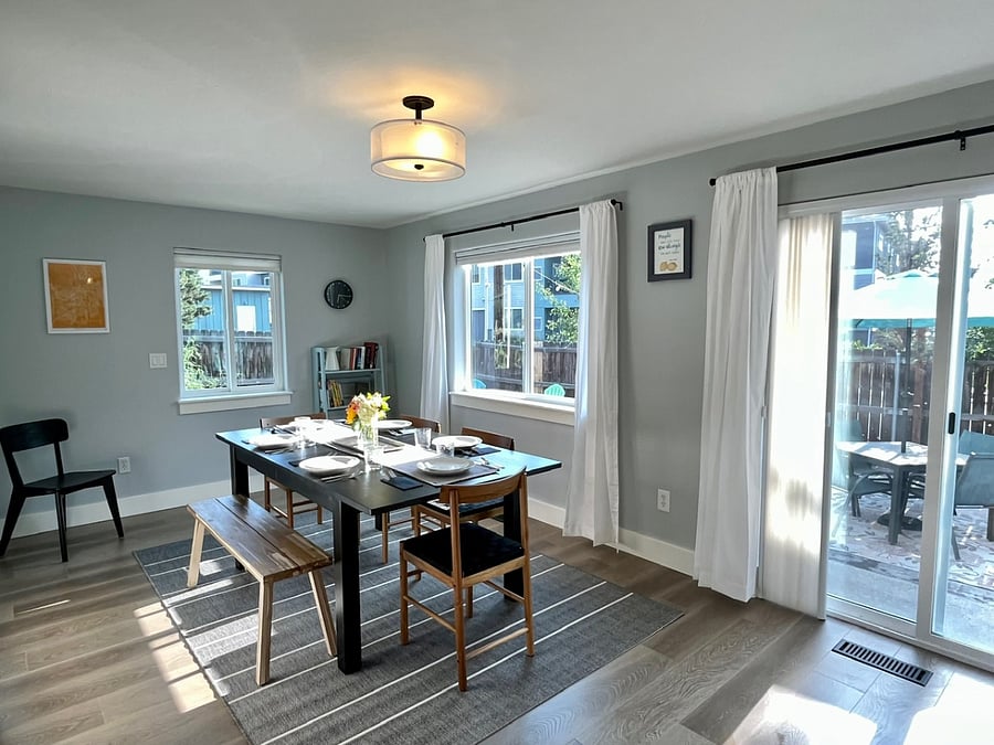 Extra chairs and a leaf expand the dining space to accommodate 8.