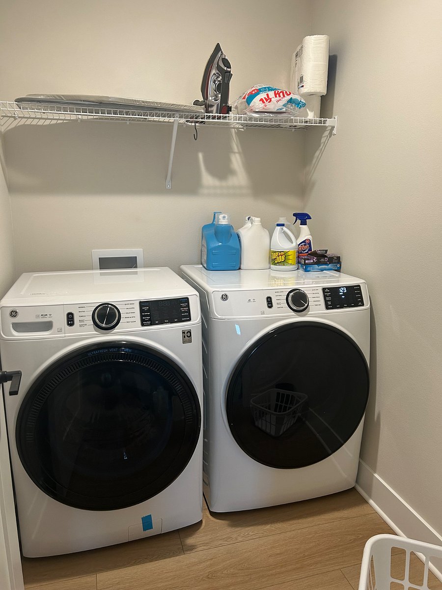 Full size washer and dryer. Iron and small ironing board