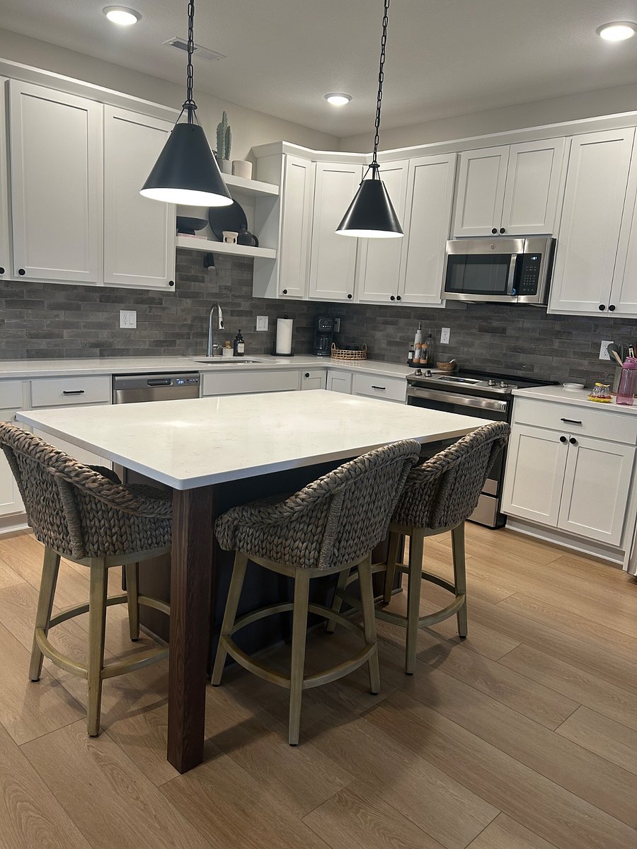 walk-in pantry, Carrera quartz countertops, Italian tile backsplash and shaker style soft close cabinetry.