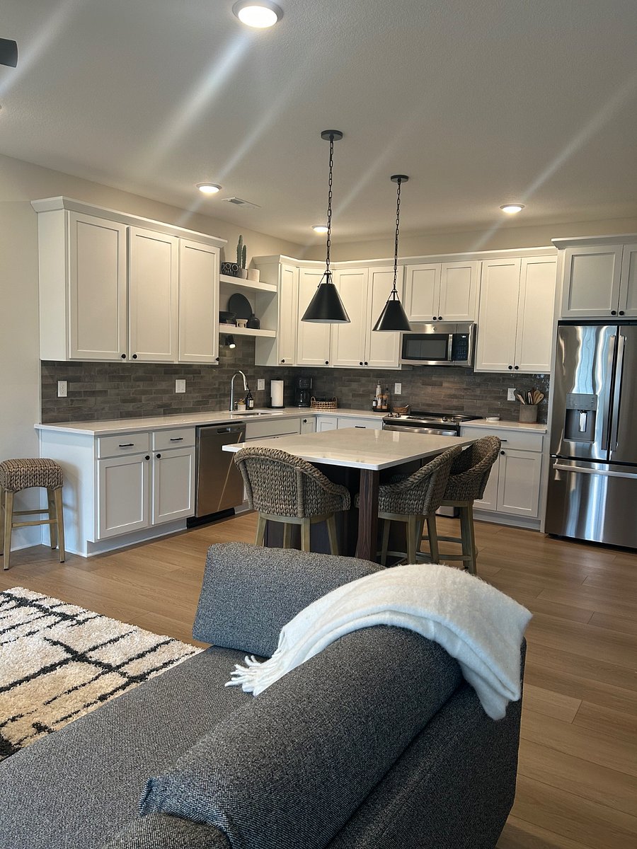walk-in pantry, Carrera quartz countertops, Italian tile backsplash and shaker style soft close cabinetry.