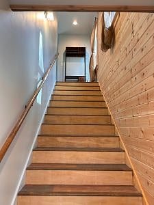 Staircase through front door entrance.