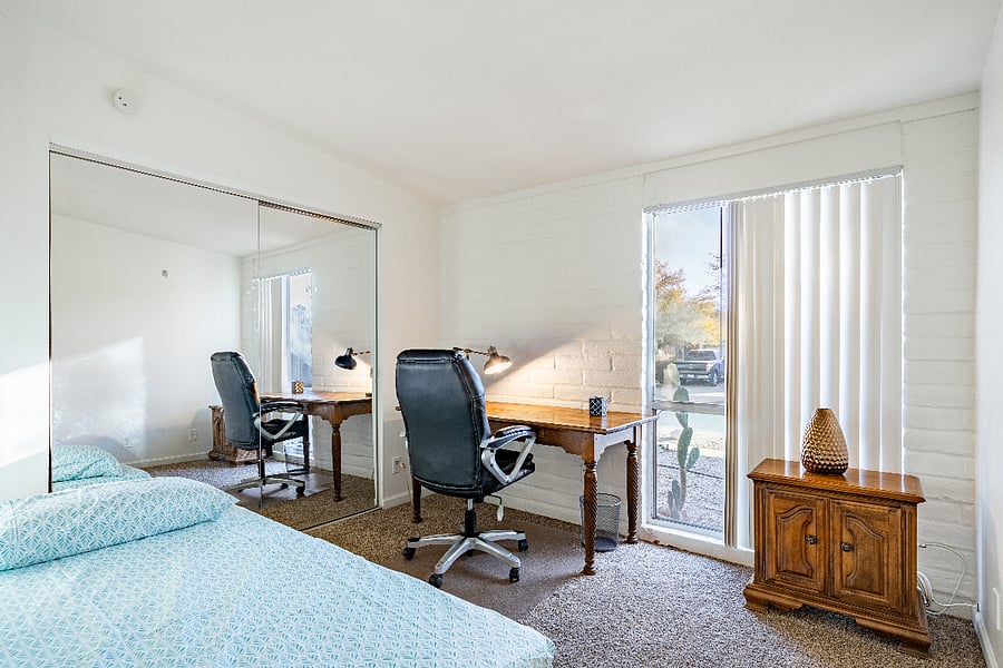 Third bedroom with work desk and stacked twin beds