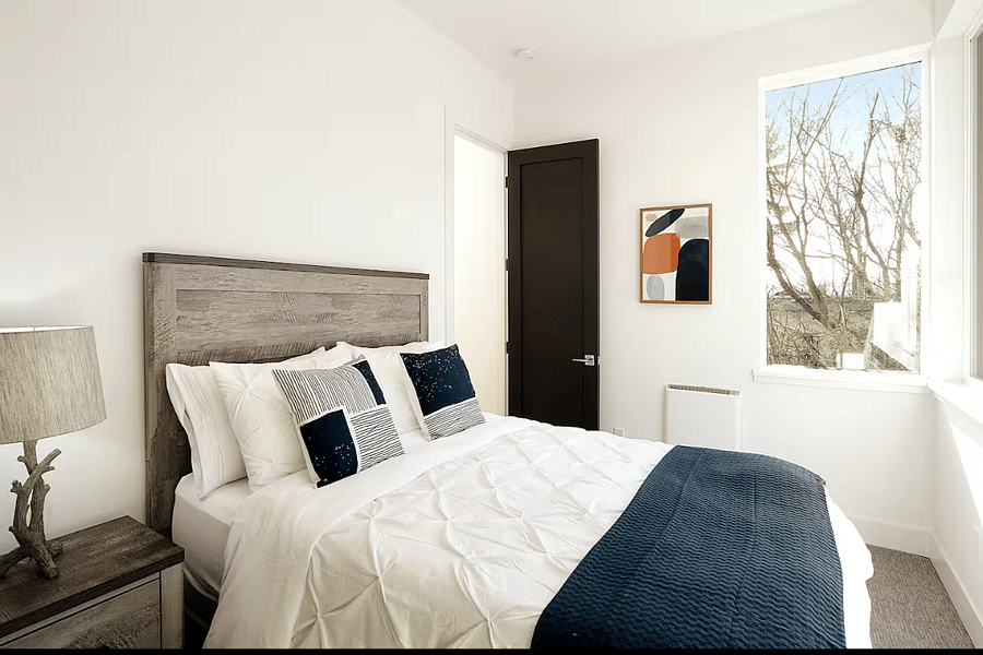 The second Queen bedroom on level 2. Hotel style bedding and extra blanket provided with every bed. Extra pillows in the bedroom closet