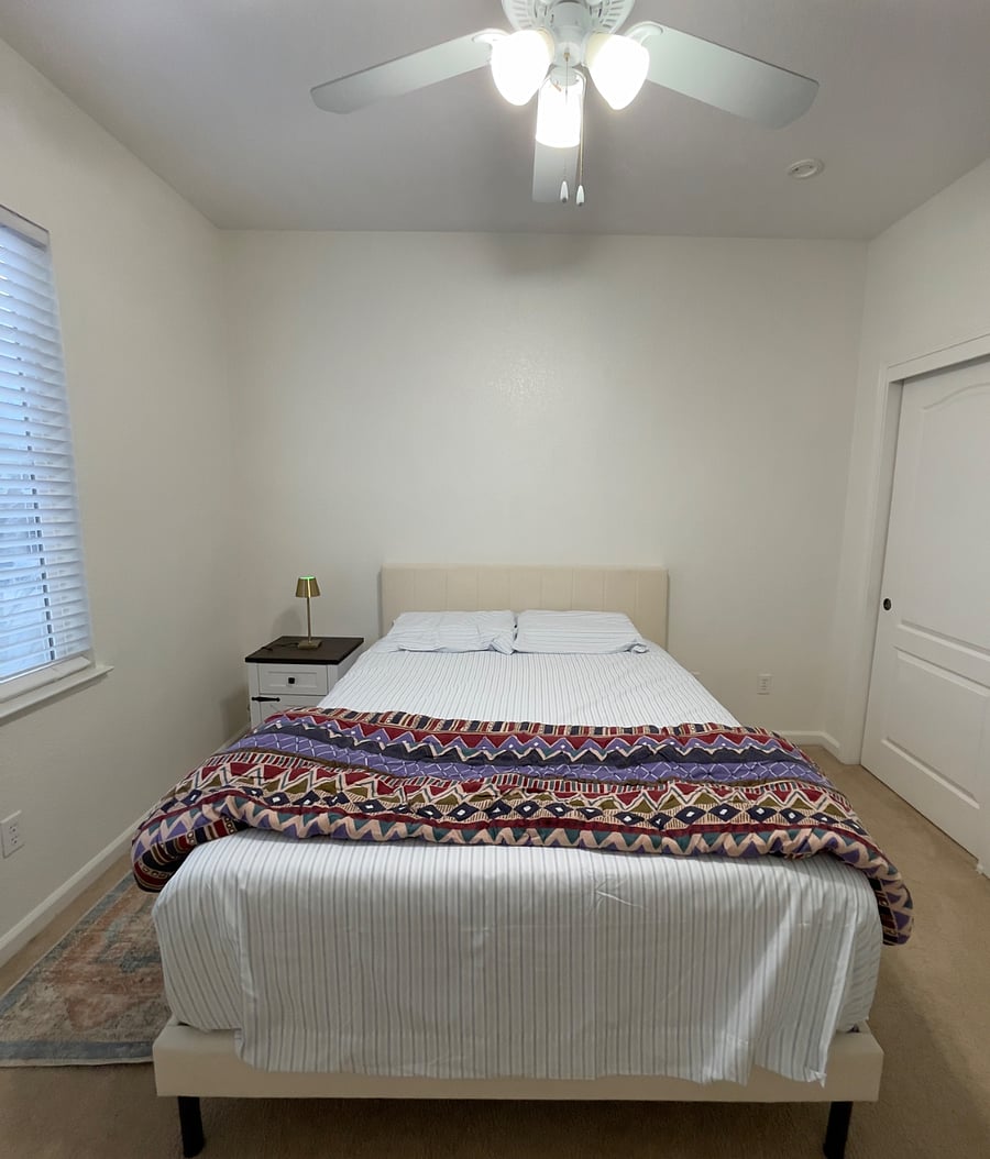 Downstair bedroom with a queen bed.
