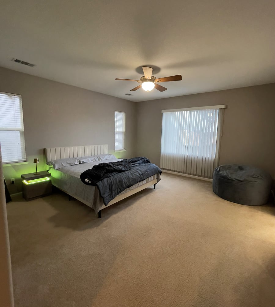 Master bedroom with a king size bed.