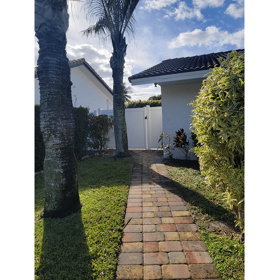 Walkway to the side of the house for your room entry. 