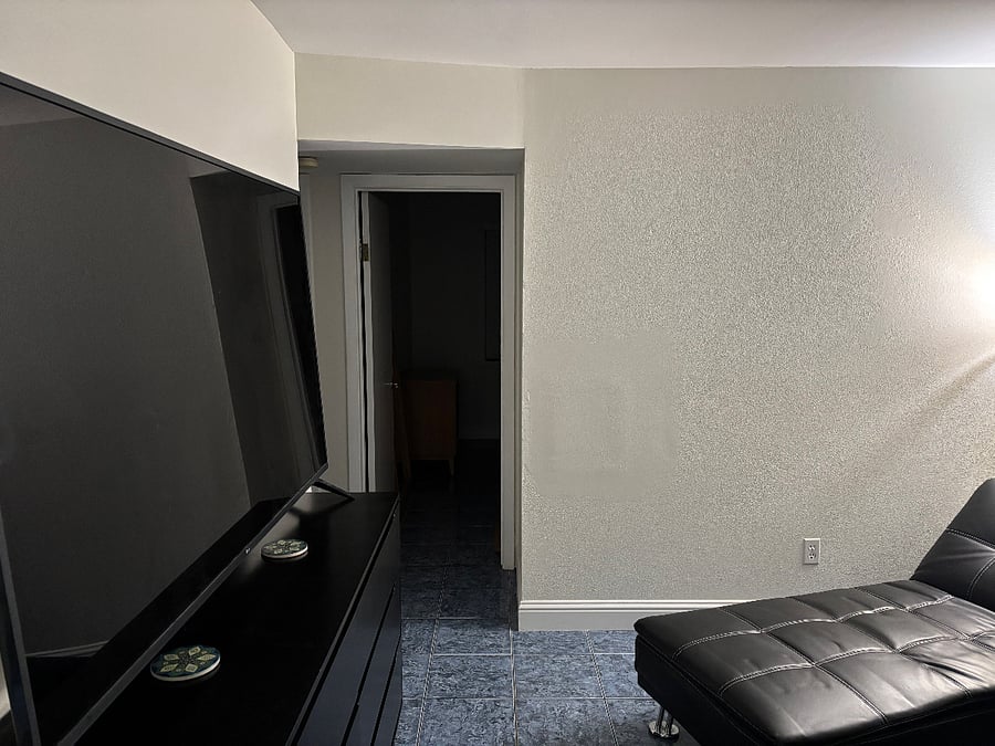 tile throughout, leather couch and chaise lounger. Leather couch folds down to bed after a long day. Large TV has many apps and a digital antenna for local television.