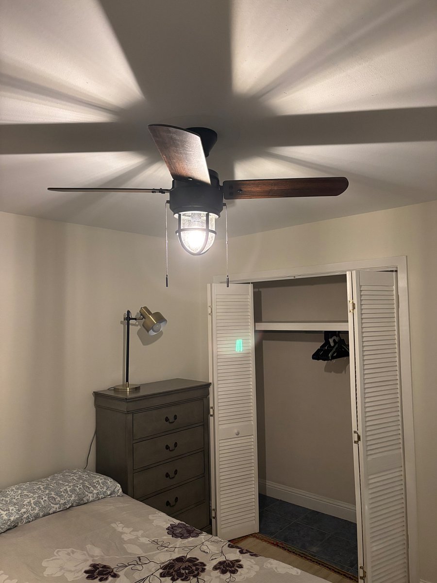 Ceiling fan and long closet with hangers along with 2nd dresser, about 4 tall with plenty of drawers.