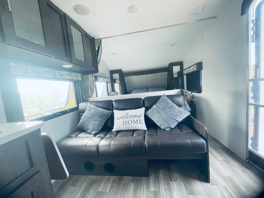 This leather couch unfolds into a comfortable single bed