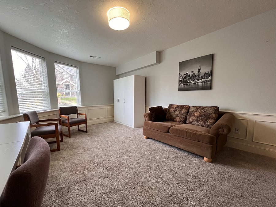 Front room can be set up as a home office or a second bedroom, with twin bed or king bed; or full/double bed rom main bedroom if king bed is put in main bedroom. Room includes a large L-shaped desk, love seat (can be moved to 'hall living area' if bed is put in here) and wardrobe.