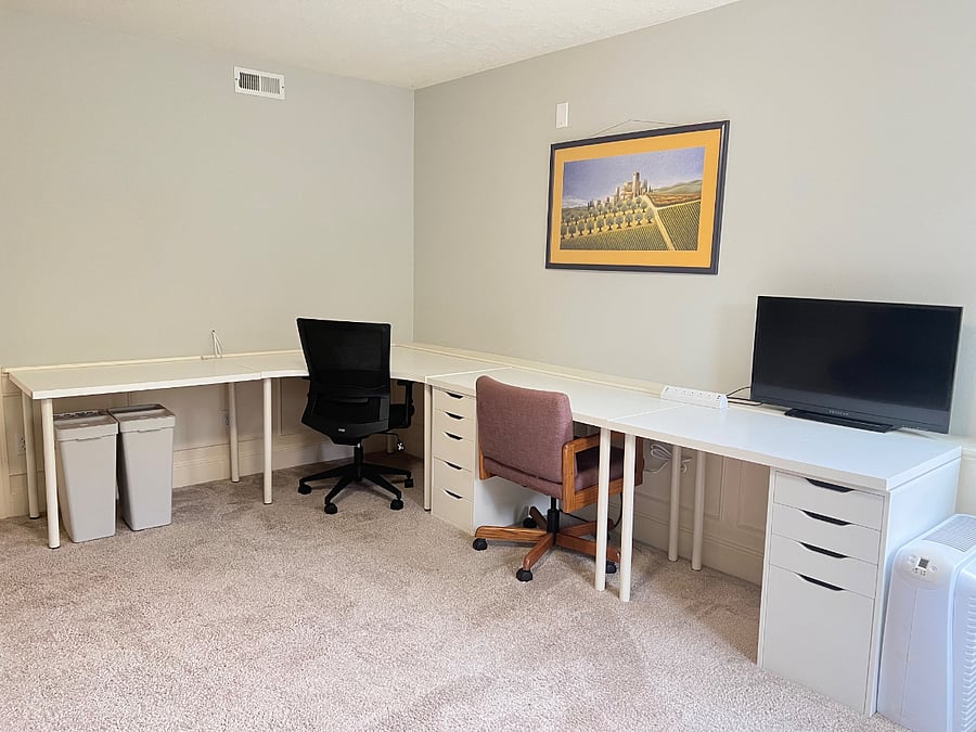 Front room has large desk that can accommodate multiple people.