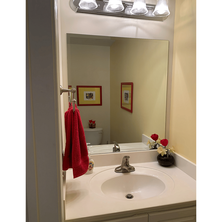 The half bath. It's along the entrance hallway. Across the hall behind it's own door, is stackable washer and dryer.