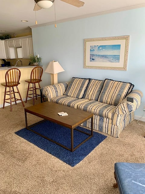 Sofa in living room for easy TV viewing and staring out at frequent sunsets ...