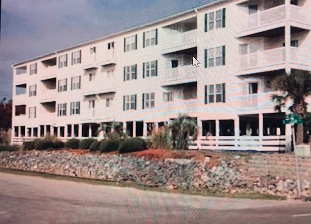 Beach side of building. Our unit is 1st story up. Shows deck, second one over from far left ...