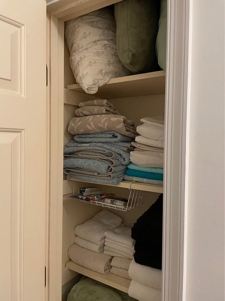 Hall linen closet for extra bedding, towels, pillows, and blankets.