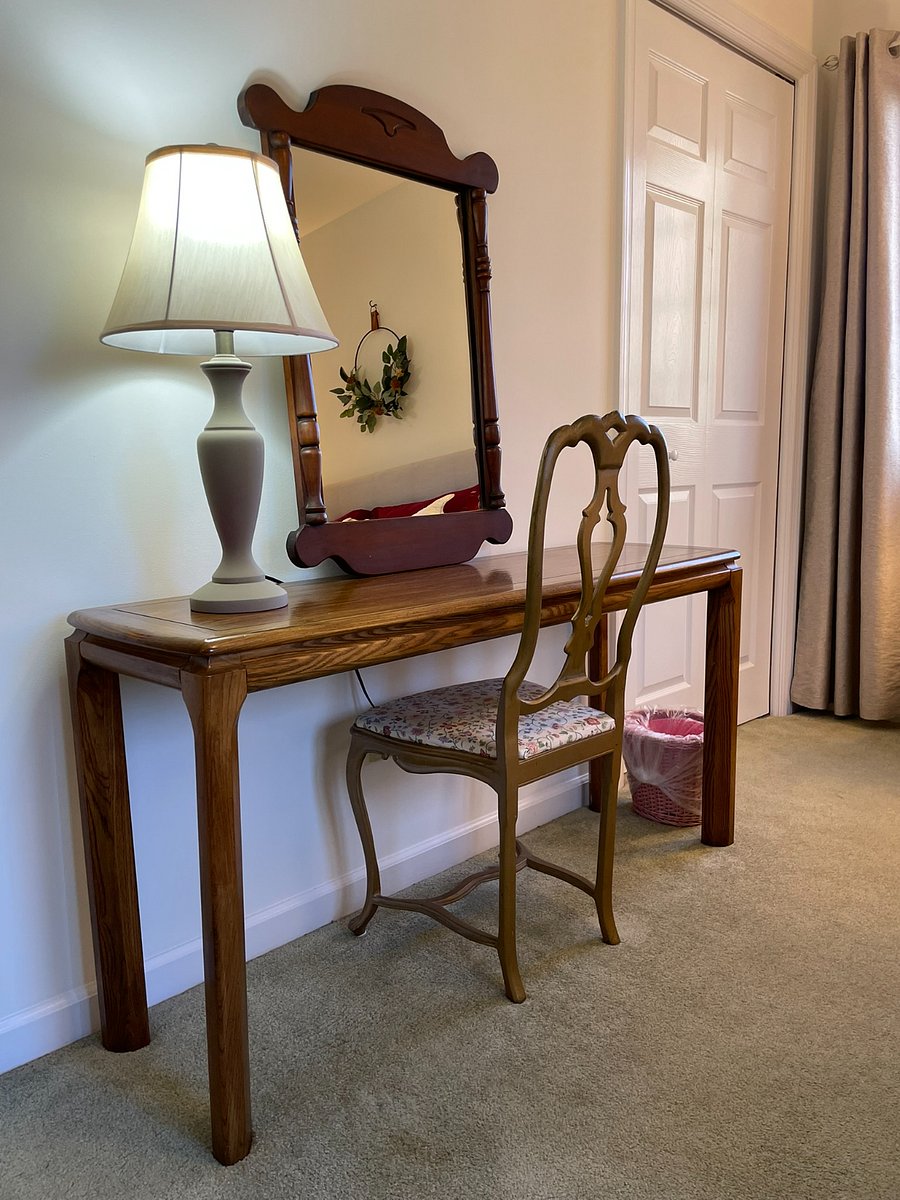 A well-lit laptop area, and room underneath for an optional mini-fridge, available upon request for those who like to keep bottled water or perishable food close by.