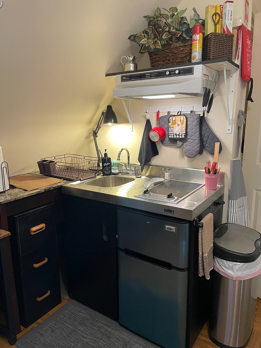 New Summit compact kitchen includes sink, stovetop, and mini-fridge all in one unit.  Range hood and fire blanket above.  Hot pads, oven mitts, dish towels, etc., available.