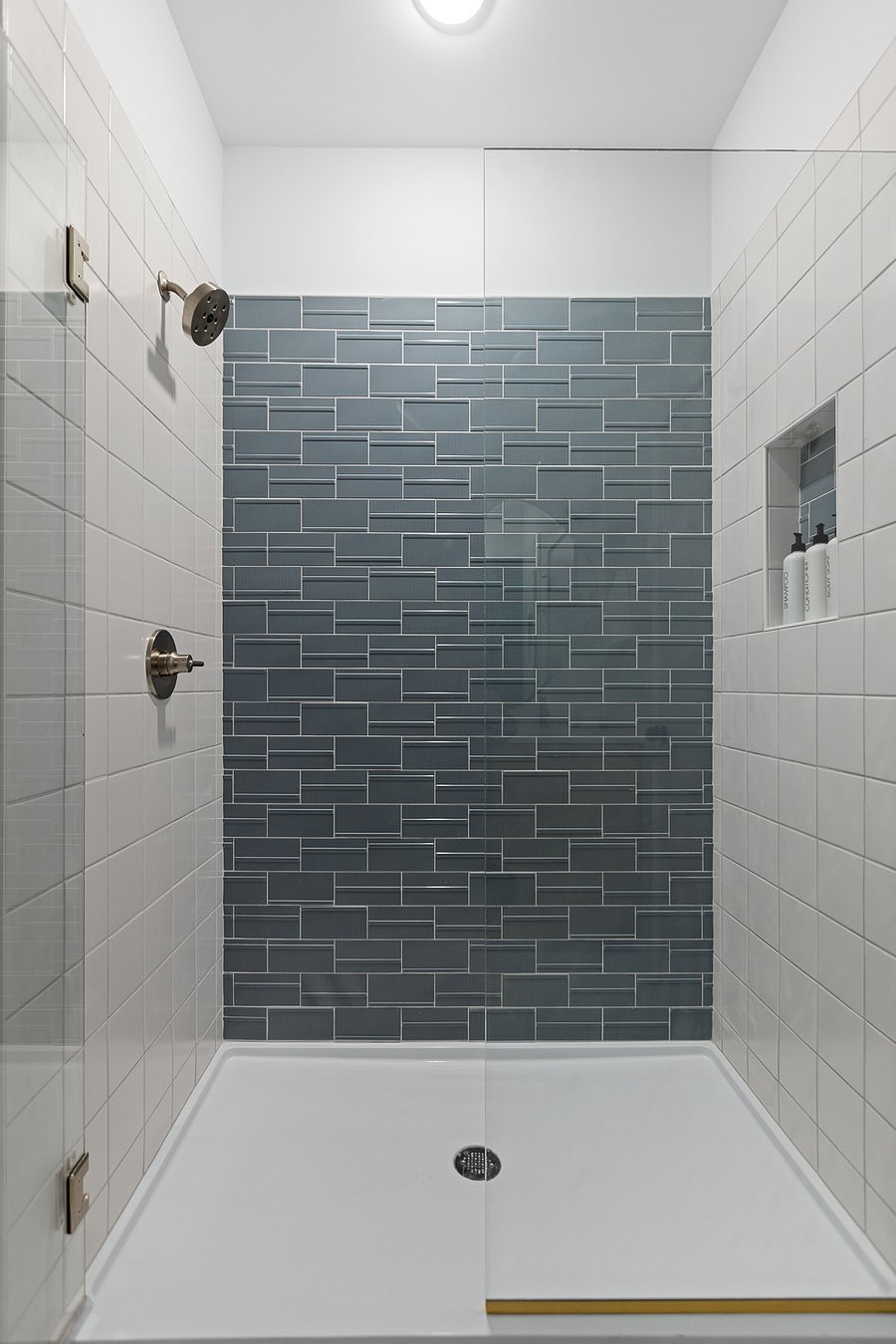 Tiled shower in Primary Bath.